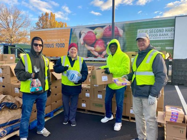 Volunteers with Second Harvest Food Bank of North Central Ohio pass out meals at a Thanksgiving Mobile Drive-Thru Pantry on Nov. 12. (Submitted)