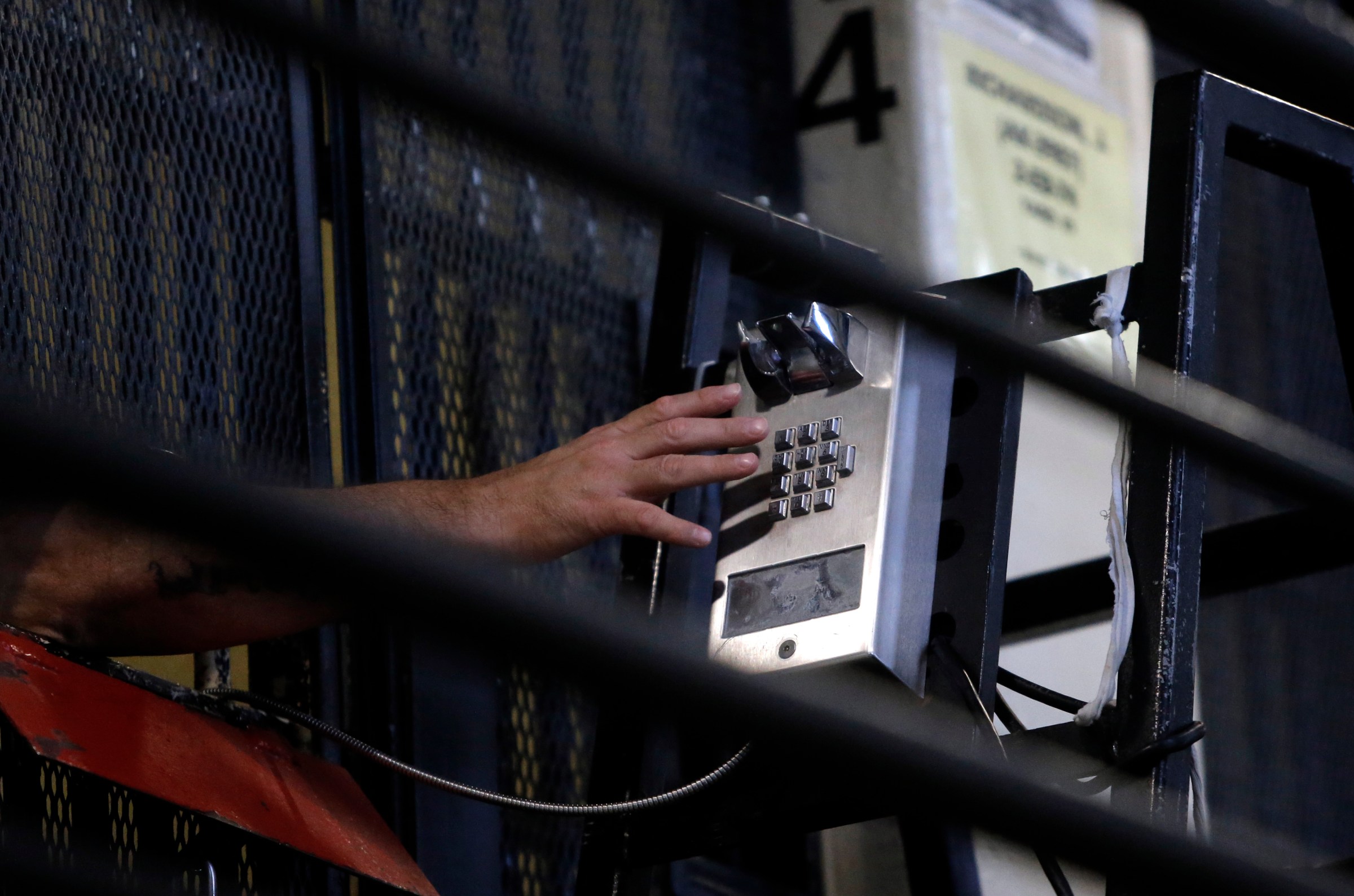 A condemned prisoner makes a phone call from his cell in East Block of death row at San Quentin State Prison on Tuesday December 29, 2015, in San Quentin, Calif.